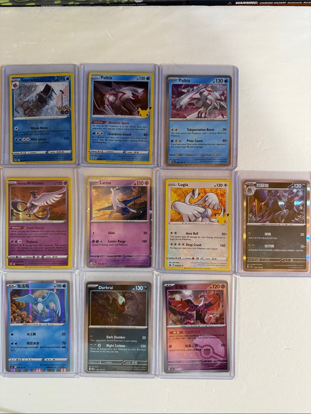 Pokemon Holo Card Lot with Blue, Yellow, Purple, White and Black Accents